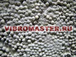 Срез полистиролбетона: вспененные гранулы полистирола - заполнитель, образующий скелет бетонного камня, цемент - вяжущее вещество
